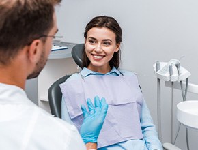 Patient smiling at dentist in treatment room