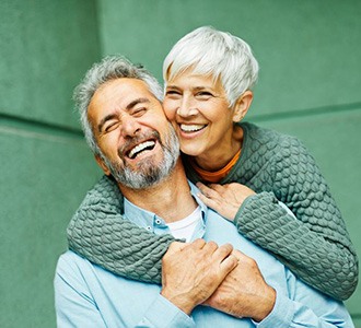 Happy senior couple enjoying loving embrace