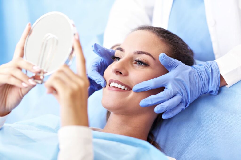 A woman at a cosmetic dentistry evaluation with her dentist.